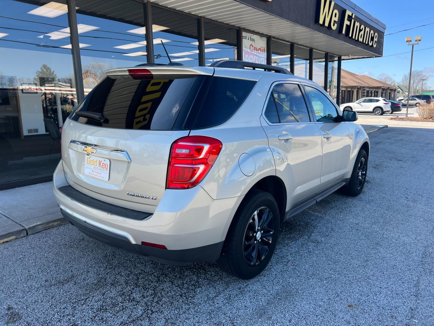 2016 Champagne Silver Met Chevrolet Equinox LT 2WD (2GNALCEK3G1) with an 2.4L L4 DOHC 16V FFV engine, 6-Speed Automatic transmission, located at 1633 W Kimberly, Davenport, IA, 52806, (563) 323-5341, 41.559456, -90.598732 - Photo#2